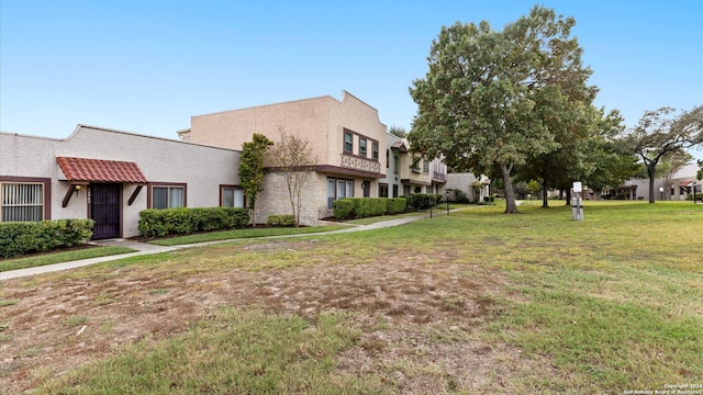 exterior space with a yard