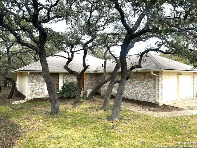 view of home's exterior with a lawn and a garage