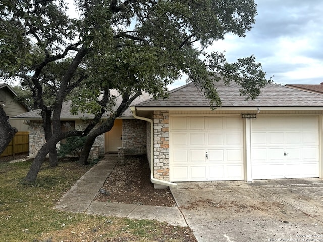 single story home with a garage