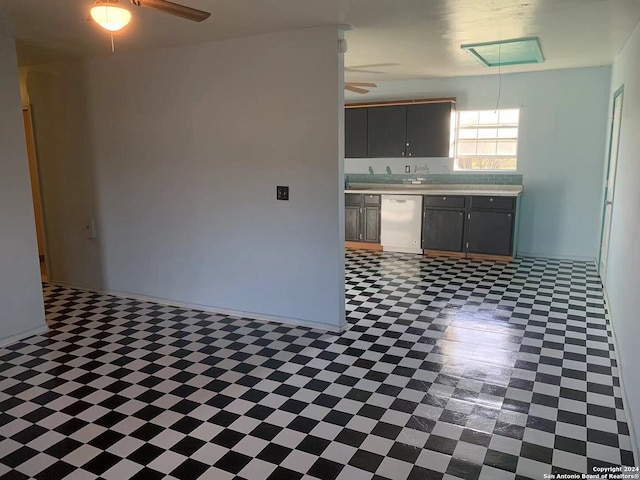 kitchen featuring dishwasher, gray cabinets, and ceiling fan