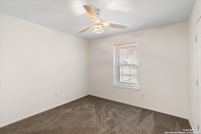 carpeted empty room with ceiling fan