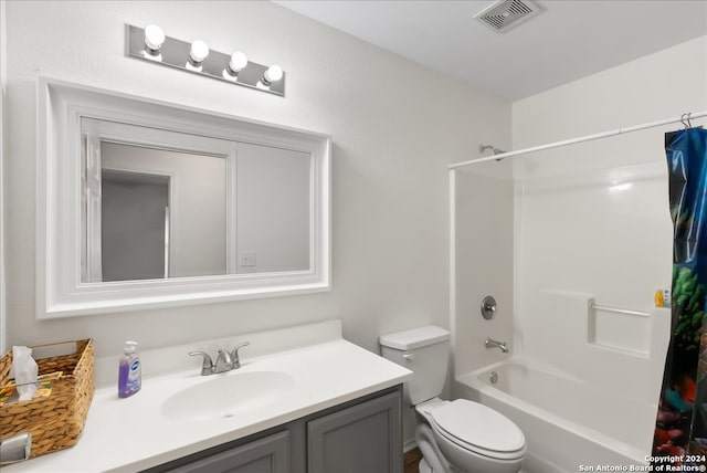 full bathroom with vanity, toilet, and shower / bath combo with shower curtain