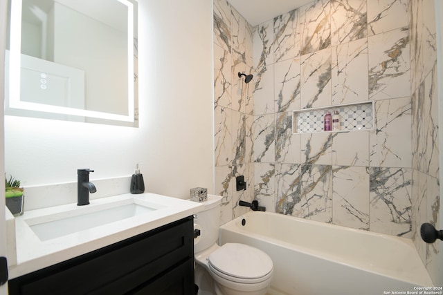 full bathroom featuring vanity, toilet, and tiled shower / bath