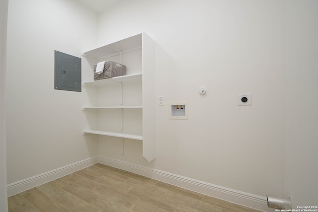 washroom featuring hookup for an electric dryer, washer hookup, electric panel, and hookup for a gas dryer