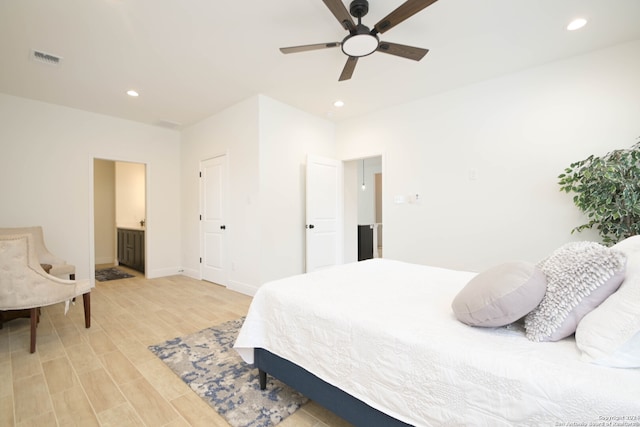 bedroom with ceiling fan and light hardwood / wood-style floors