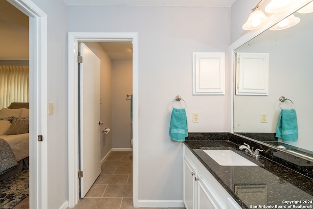 bathroom with tile patterned flooring and vanity