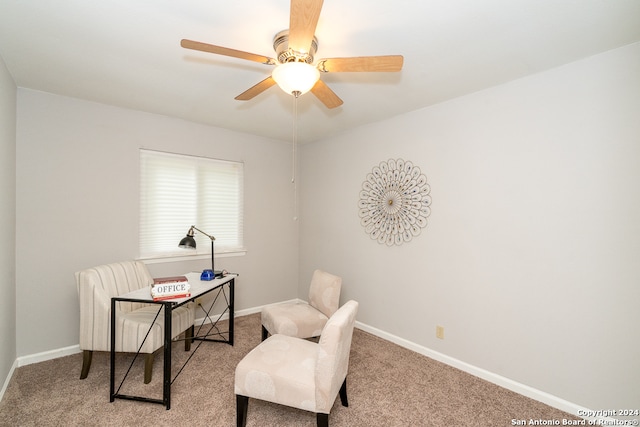 sitting room with light colored carpet and ceiling fan