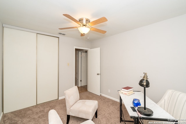 office area with ceiling fan and light carpet