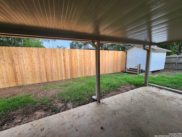 view of patio / terrace featuring a storage unit