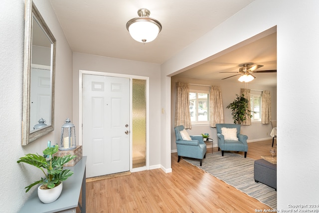 entrance foyer featuring ceiling fan and hardwood / wood-style flooring