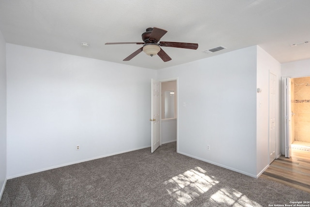 unfurnished room featuring ceiling fan and carpet floors