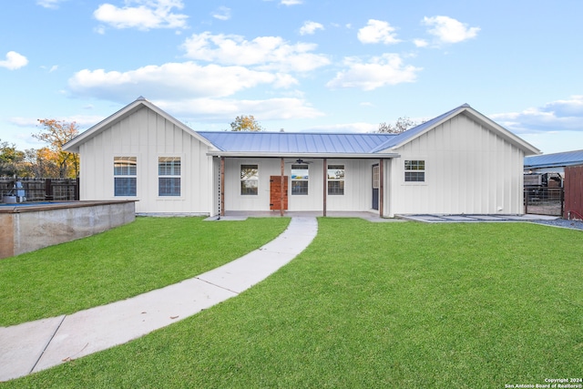 view of front of house featuring a front yard and covered porch