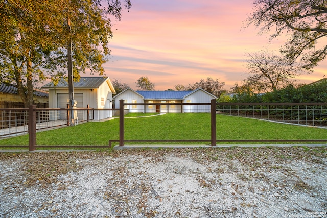 yard at dusk with an outdoor structure