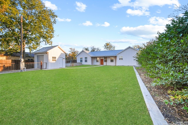 exterior space featuring a garage and an outbuilding