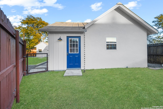 rear view of house with a lawn