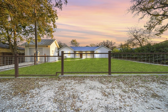 yard at dusk with an outbuilding