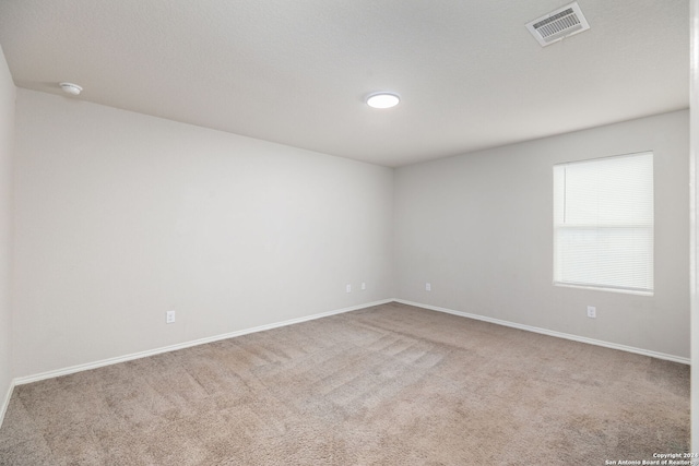 empty room featuring carpet flooring