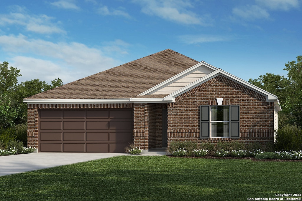 view of front of home with a garage and a front yard