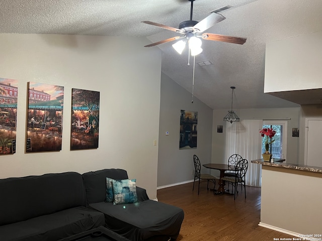 living room featuring a textured ceiling, ceiling fan, dark hardwood / wood-style floors, and lofted ceiling