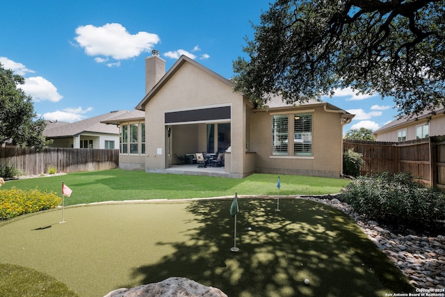 back of property featuring a patio area