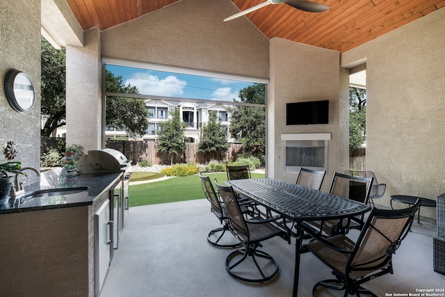 view of patio / terrace with ceiling fan, area for grilling, and sink