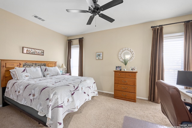 bedroom featuring ceiling fan and carpet