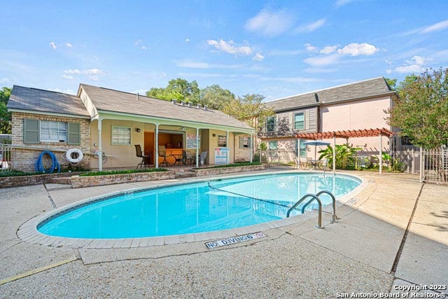 view of pool featuring a patio