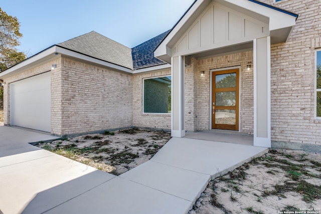 property entrance with a garage