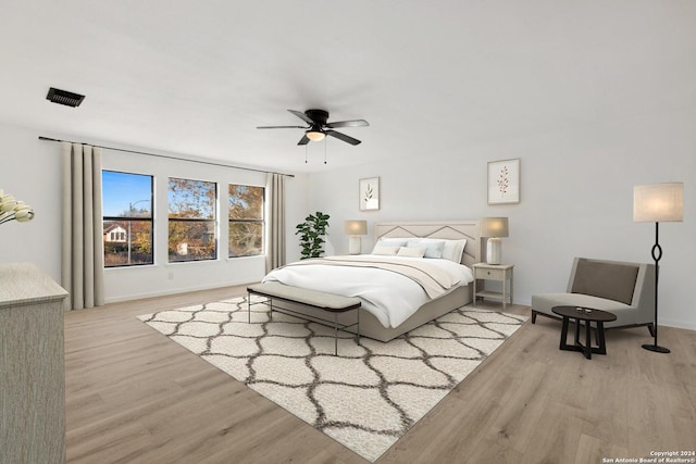 bedroom with light wood-type flooring and ceiling fan