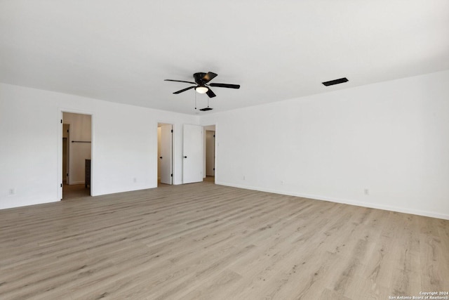 spare room featuring ceiling fan and light wood-type flooring