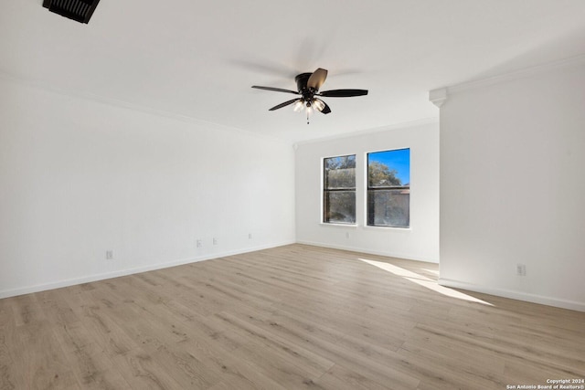 unfurnished room with ceiling fan, light hardwood / wood-style floors, and crown molding