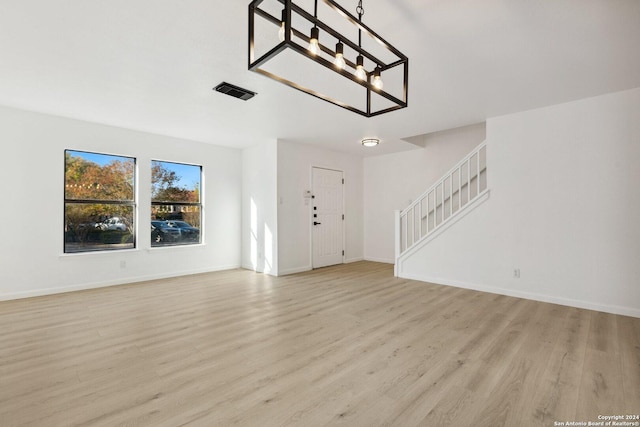 foyer with light hardwood / wood-style floors