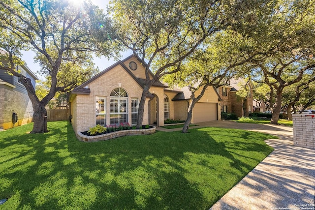 view of front of property featuring a front lawn and a garage