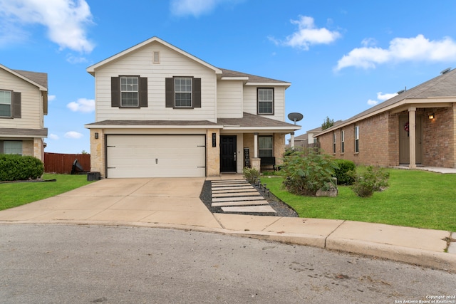 front facade with a front yard and a garage