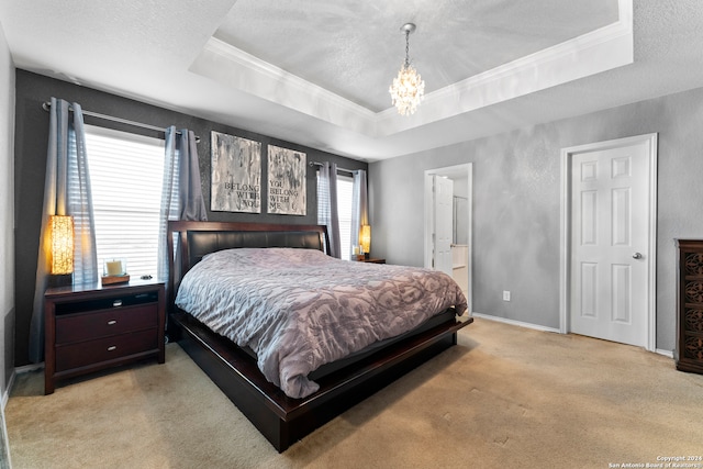 carpeted bedroom featuring a raised ceiling, multiple windows, and crown molding