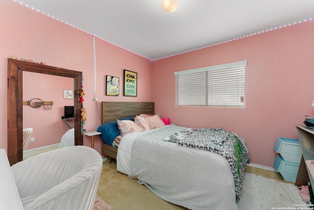 bedroom featuring light carpet