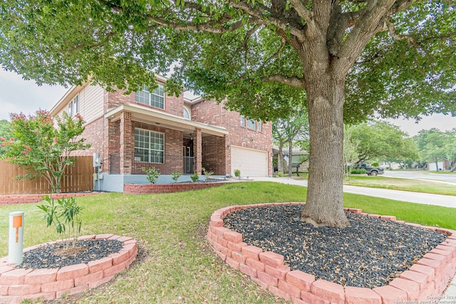 view of front of property with a garage and a front yard