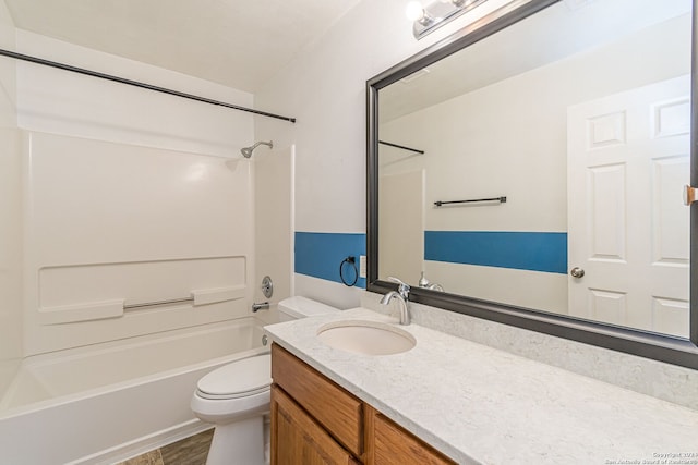 full bathroom featuring hardwood / wood-style flooring, vanity, toilet, and washtub / shower combination