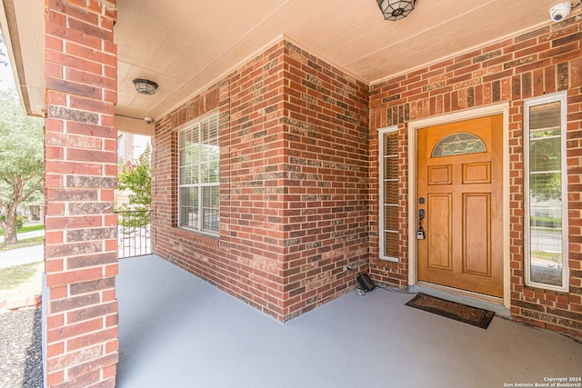 entrance to property featuring covered porch