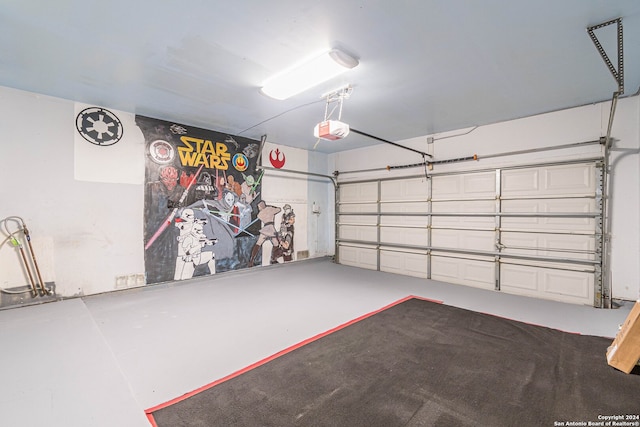 garage featuring a garage door opener