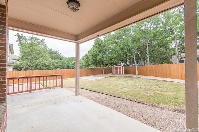 view of patio featuring a shed