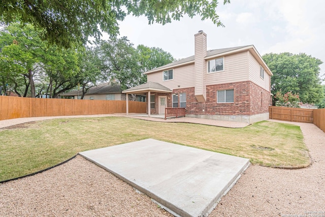 rear view of house featuring a patio