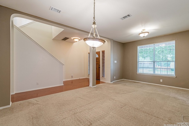 unfurnished room with hardwood / wood-style flooring