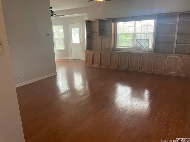 unfurnished room with hardwood / wood-style floors and ceiling fan