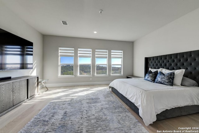 bedroom with light hardwood / wood-style flooring