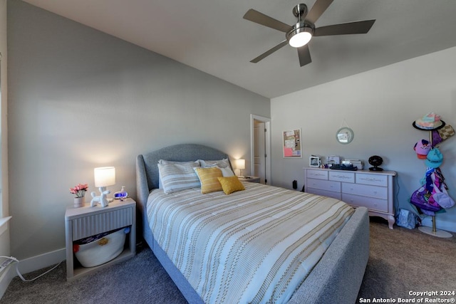 bedroom featuring ceiling fan and dark colored carpet