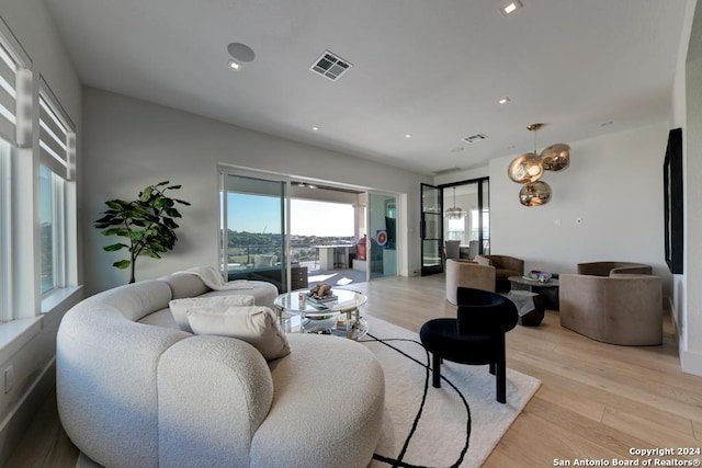 living room with light hardwood / wood-style floors