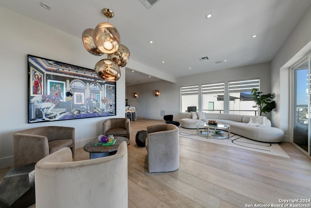 living room with light hardwood / wood-style floors and a wealth of natural light