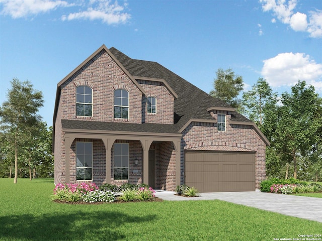 view of front facade with a garage and a front yard