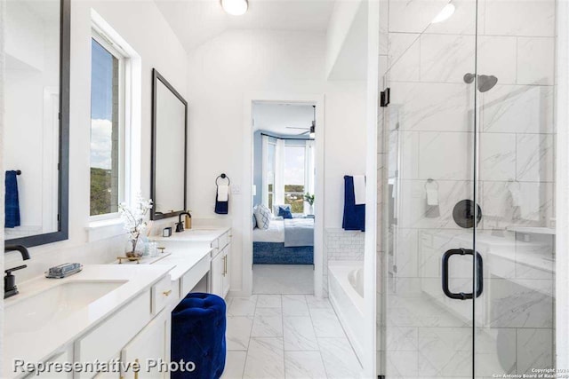 bathroom with vanity, independent shower and bath, ceiling fan, and lofted ceiling